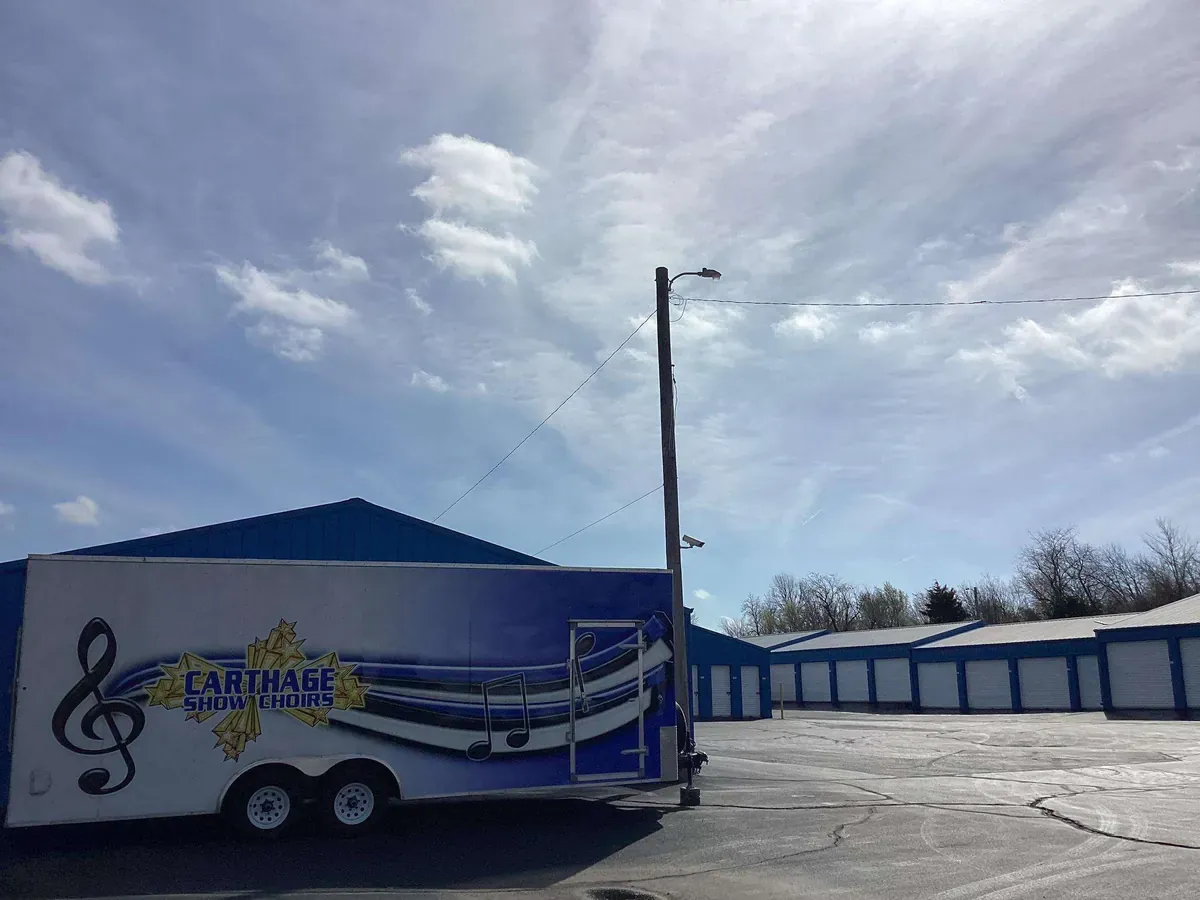 Carthage Show Choirs parked at a storage facility