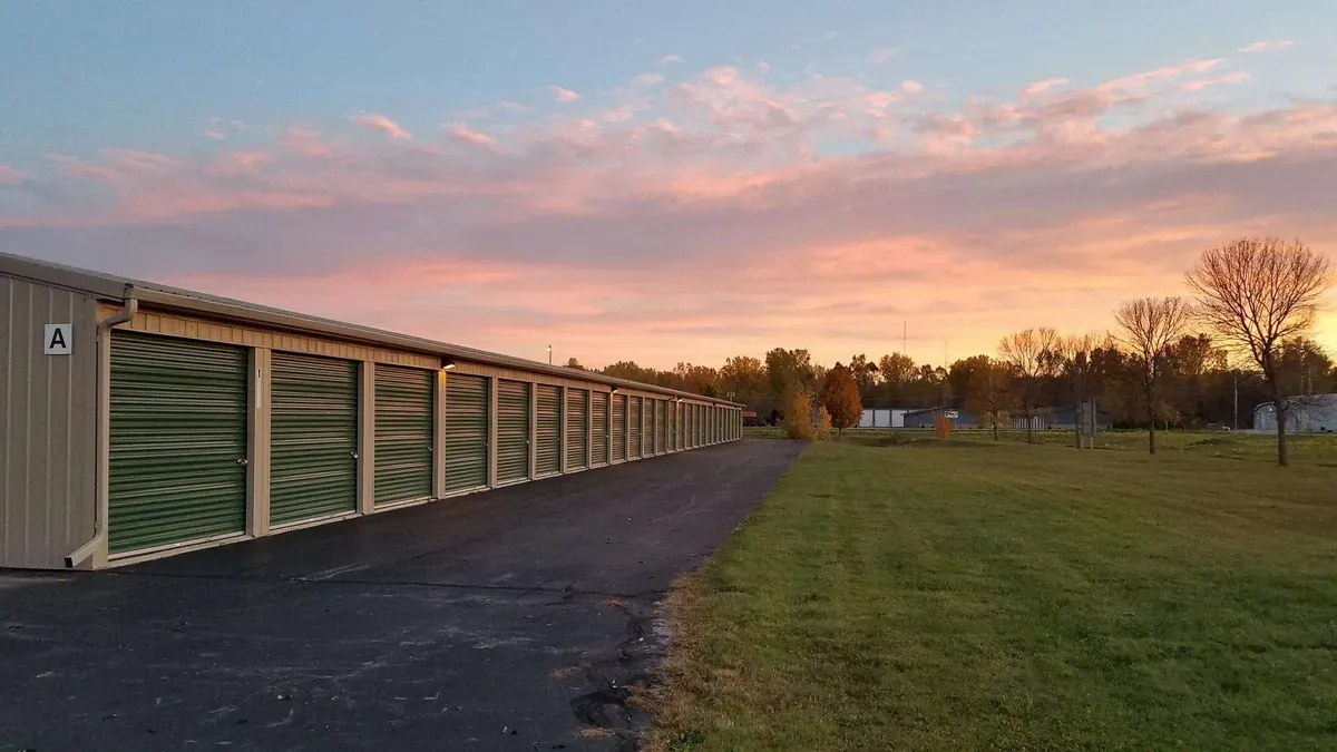Drive up self storage facility at sunset
