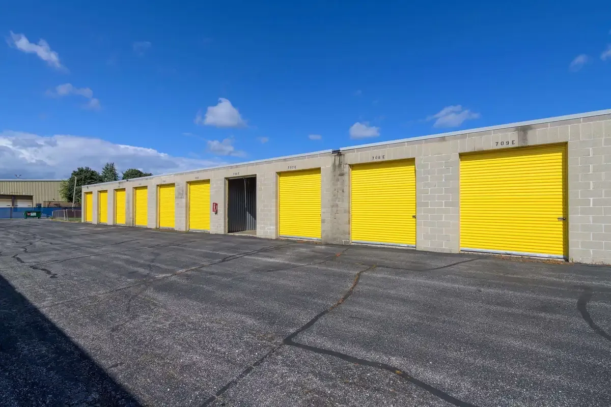 Drive up self storage units with yellow doors
