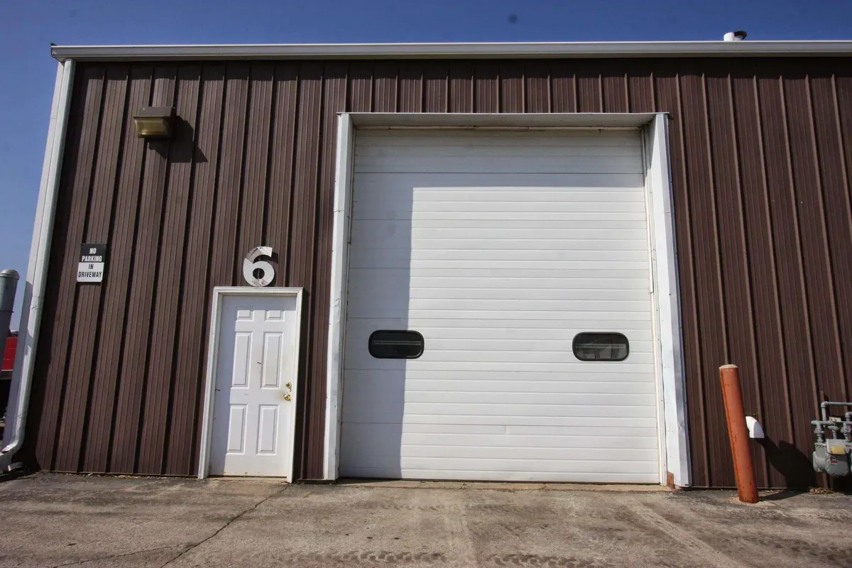 Enclosed drive in self storage unit with smaller door access