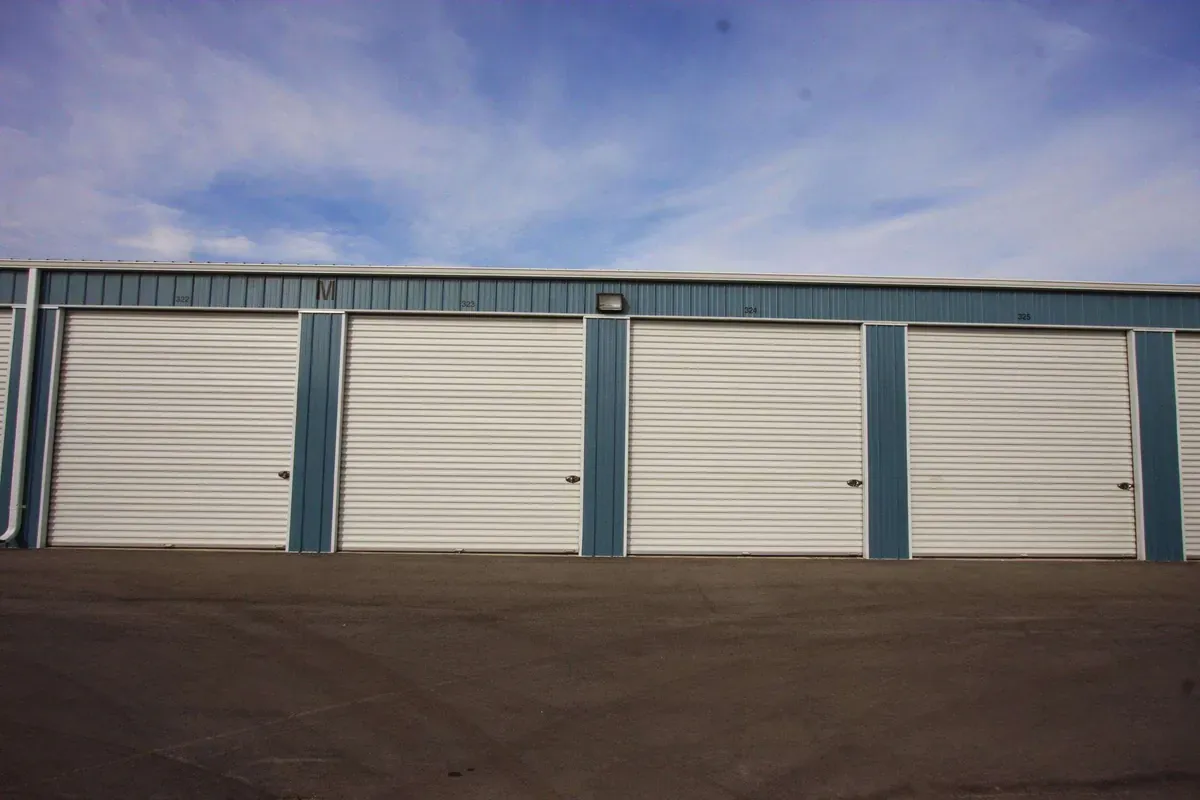 Row with large drive up self storage buildings