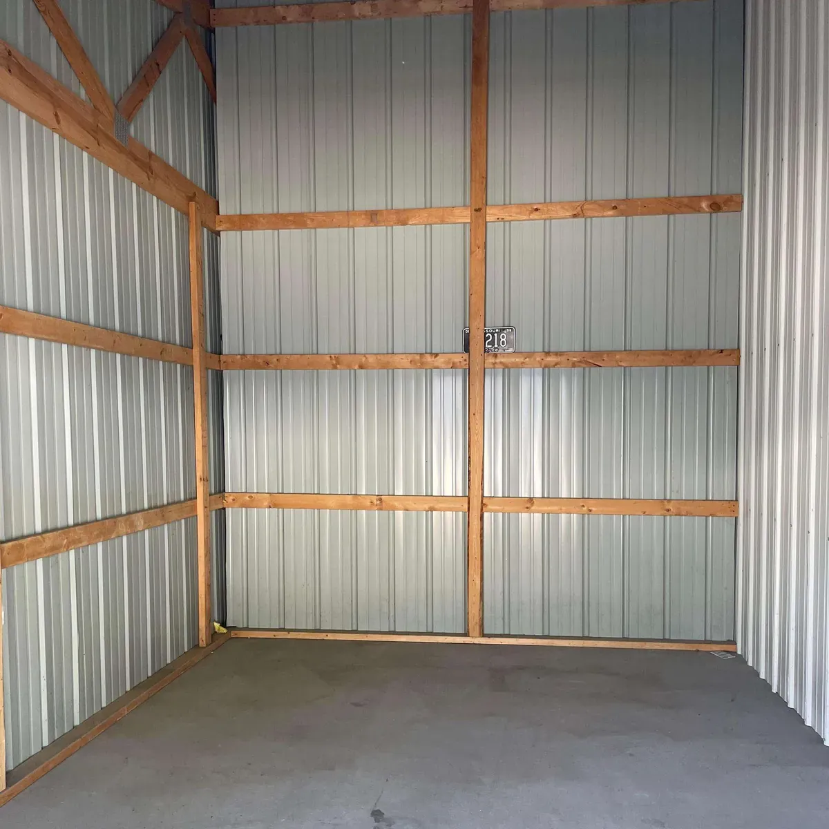 inside of a storage unit with wooden beams